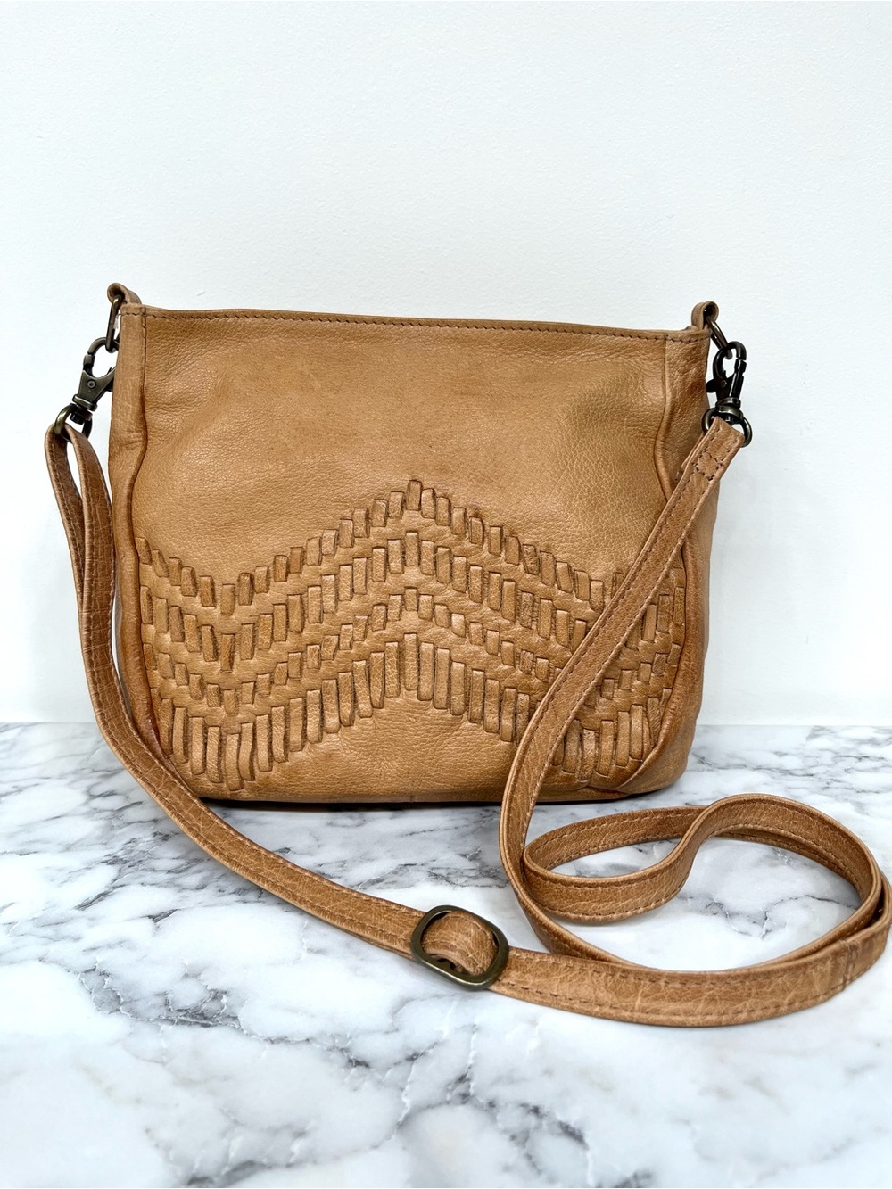 Anthropologie Day and Mood distressed tan woven leather peony crossbody bag
